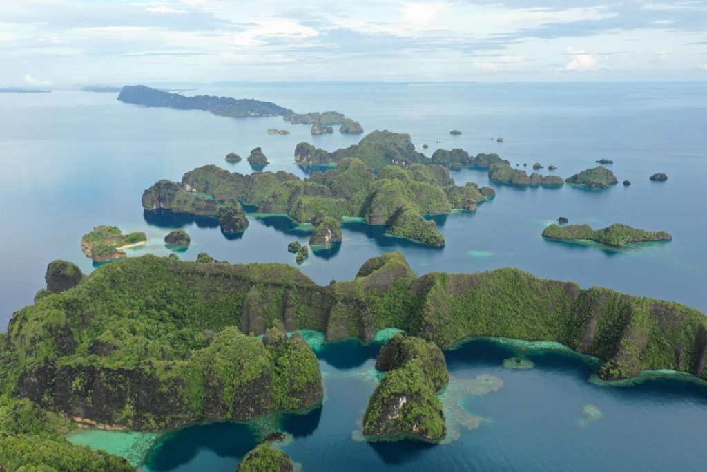 Explore the majestic archipelago of Raja Ampat, Indonesia, from above.