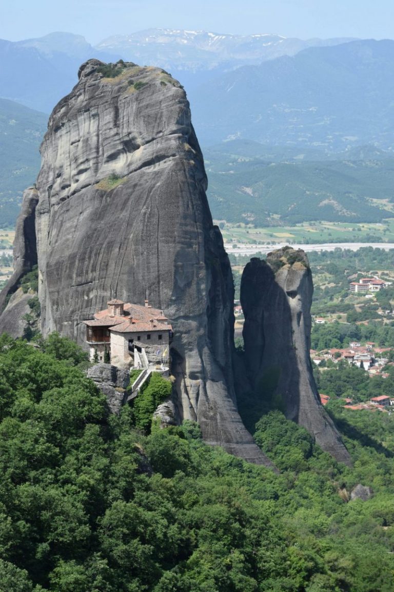 Stunning view of Meteora's rock formation and monastery in Greece.