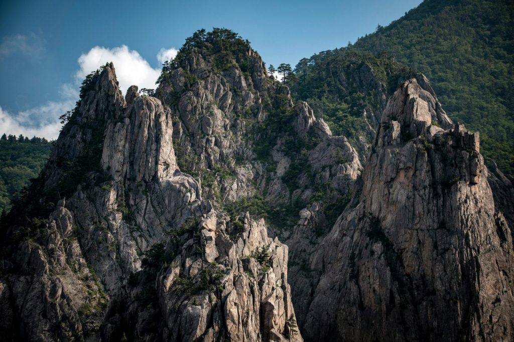 Stunning view of the craggy peaks in Seoraksan National Park, Korea, showcasing rocky textures and lush greenery.